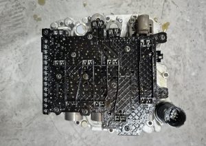 Volkswagen DSG mechatronic unit showing the internal circuit board and electrical connections
